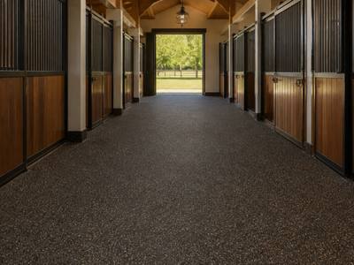Horse barn aisle finished in rubber surfacing
